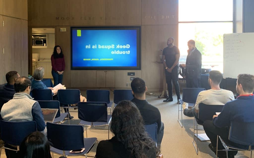 A group of new Infosys employees—including Trinity alumna Francesca L. Velarde ’19 (right)—present to the group during a training module held in Trinity’s Raether Library and Information Technology Center.